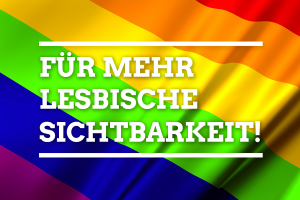 Eine sechsfarbige Regenbogenfahne trägt die Aufschrift: Für mehr lesbische Sichtbarkeit
